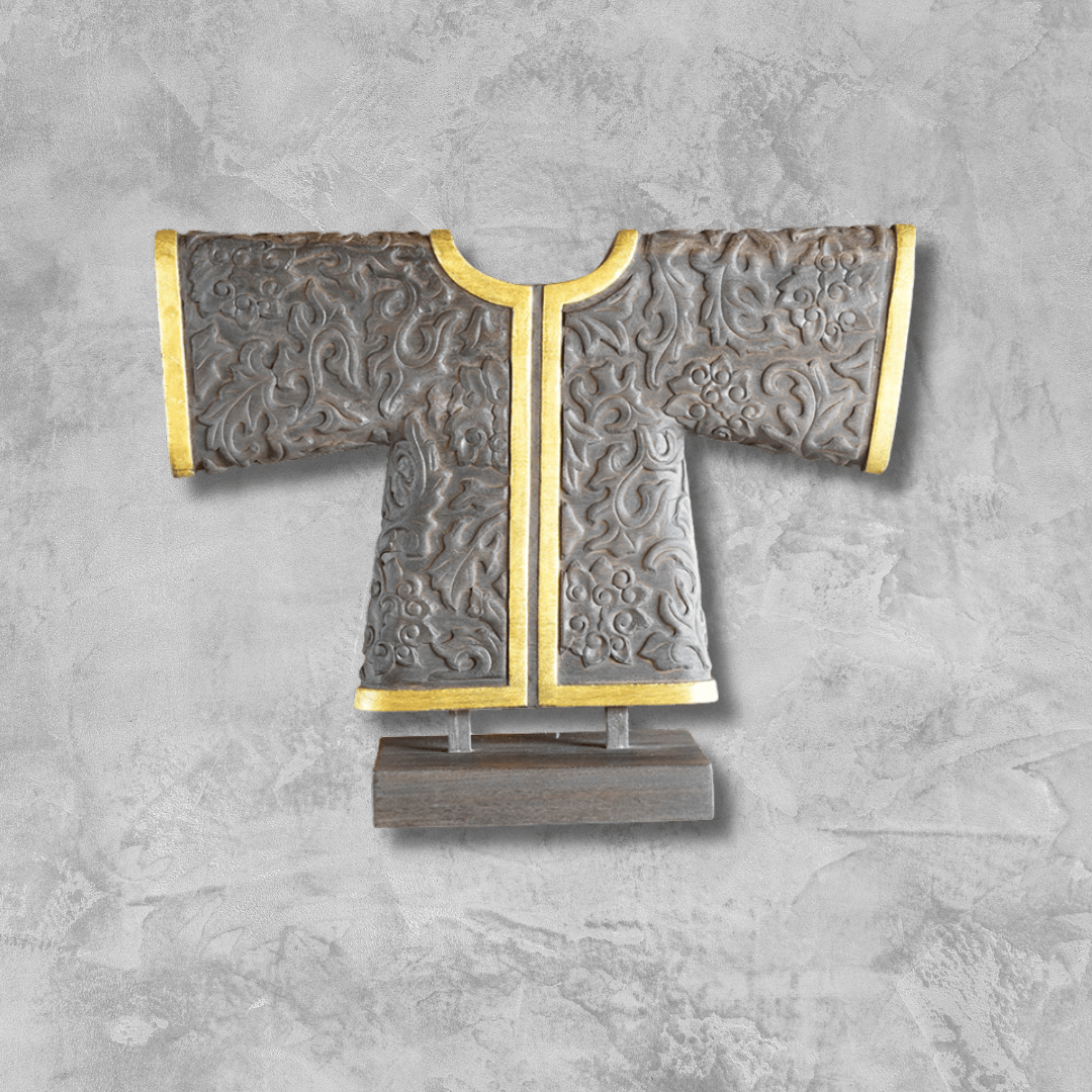a decorative piece of wooden art work with a gold and silver colored coat
